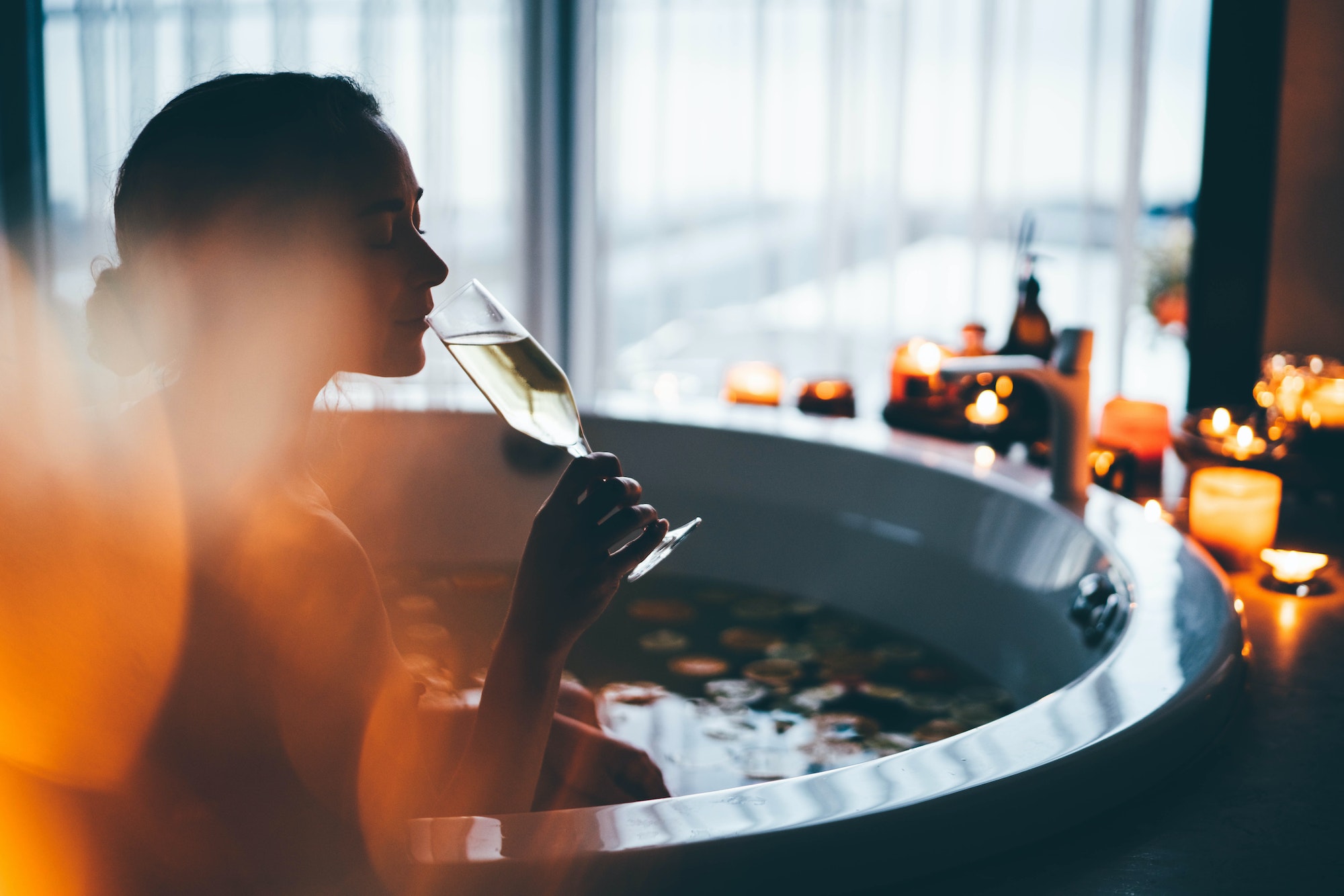 Beautiful woman relaxing at spa. Young lady relaxing in jacuzzi.