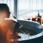 Beautiful woman relaxing at spa. Young lady relaxing in jacuzzi.